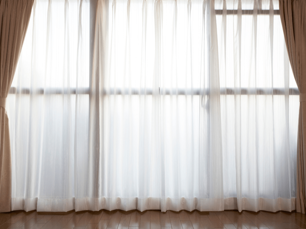 Cleaned curtains and drapes after professional cleaning, showing fresh fabric, restored color, and a wrinkle-free finish