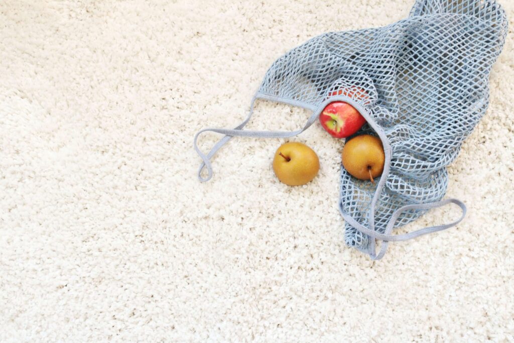 Eco-Friendly Carpet Cleaning – Safe and Effective Stain Protection Fresh fruit placed on a carpet demonstrating eco-friendly carpet cleaning methods that are safe for homes and families